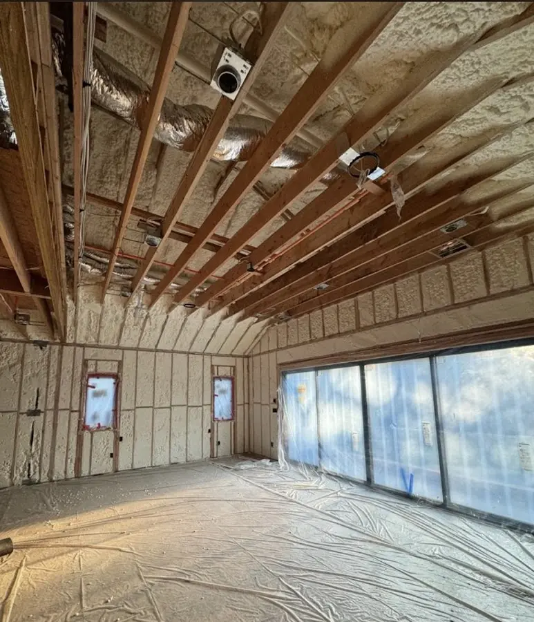 Interior walls and ceiling insulated with spray foam during new construction in Smithville